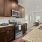 a kitchen with wooden cabinets