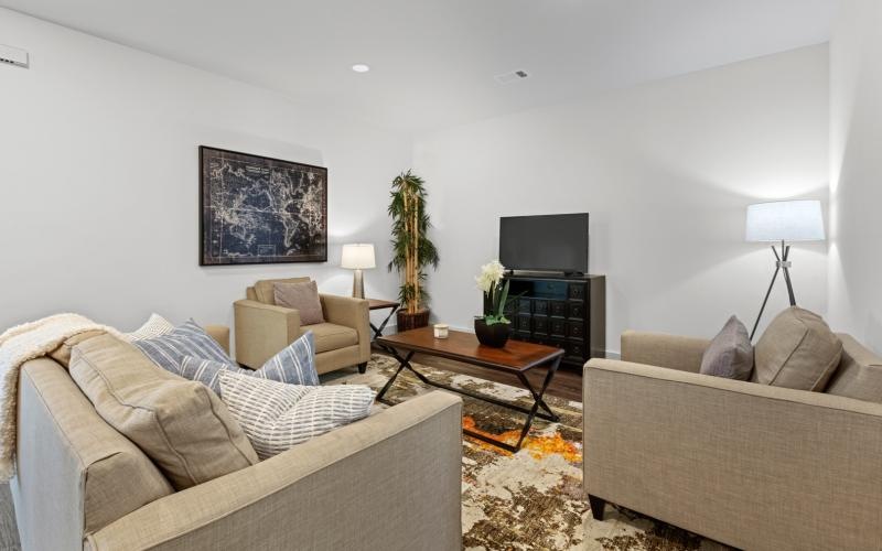 a living room with a couch and a tv
