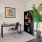 a room with a chair and a plant in it