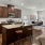 a kitchen with a bar stool and a table