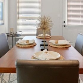 Settle into comfort at Hardy Springs Model dining room at Hardy Springs 55 and older community in Dallas, GA, featuring a dining table with place settings.